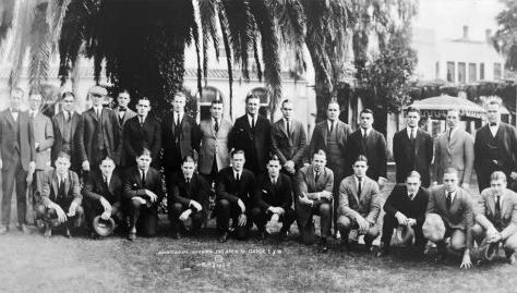 Members of W&J College's 1922 Rose Bowl team pose in front of palm trees