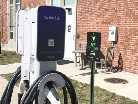 Car charging station being Clark Family Library